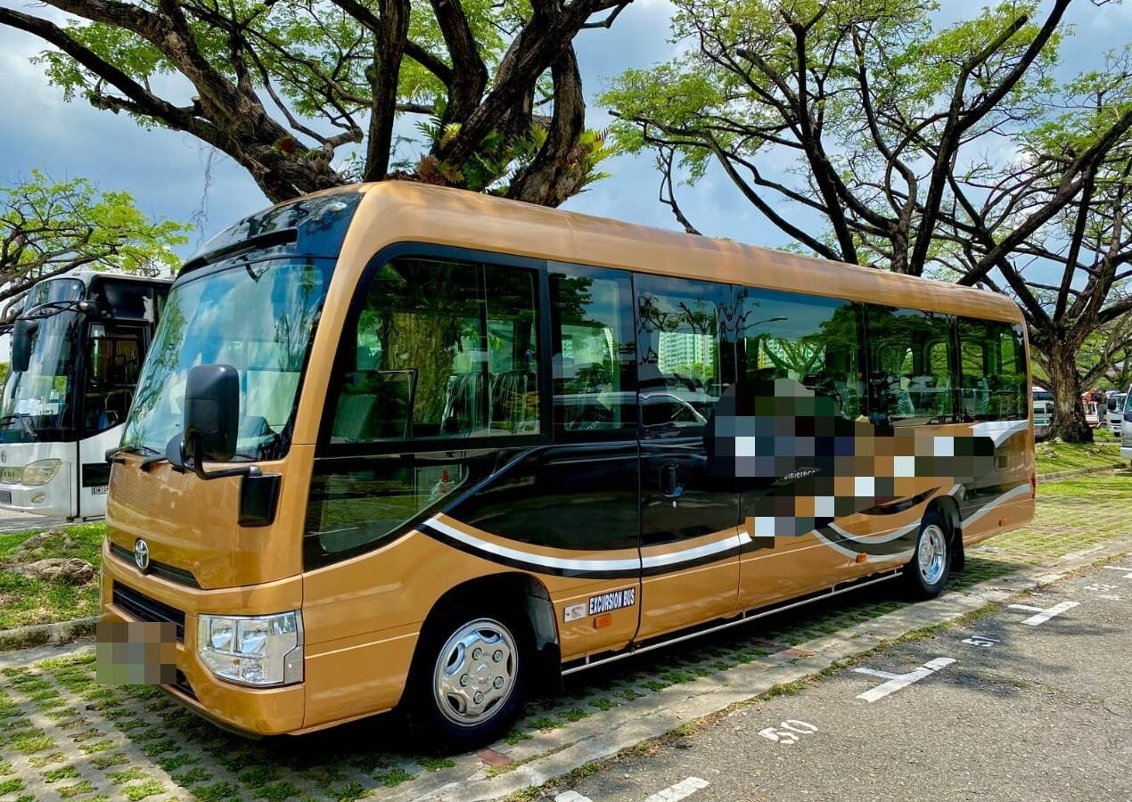 23 seater excursion bus in Singapore — Toyota Coaster minibus with EXCURSION BUS licence plate